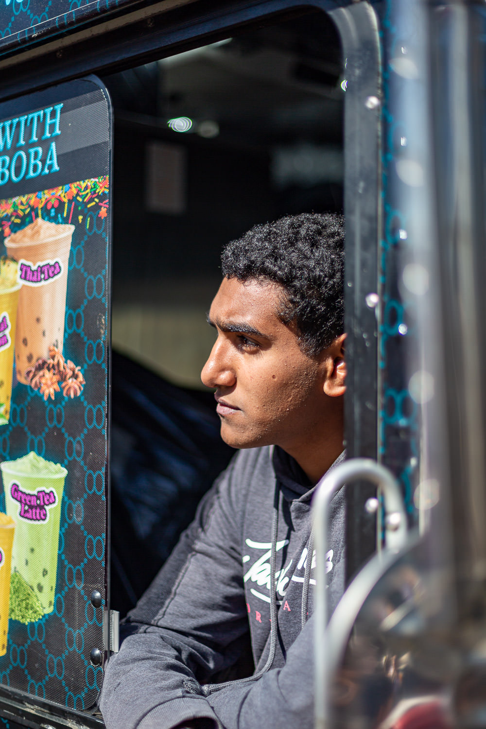 Food truck worker looking out at the tourists